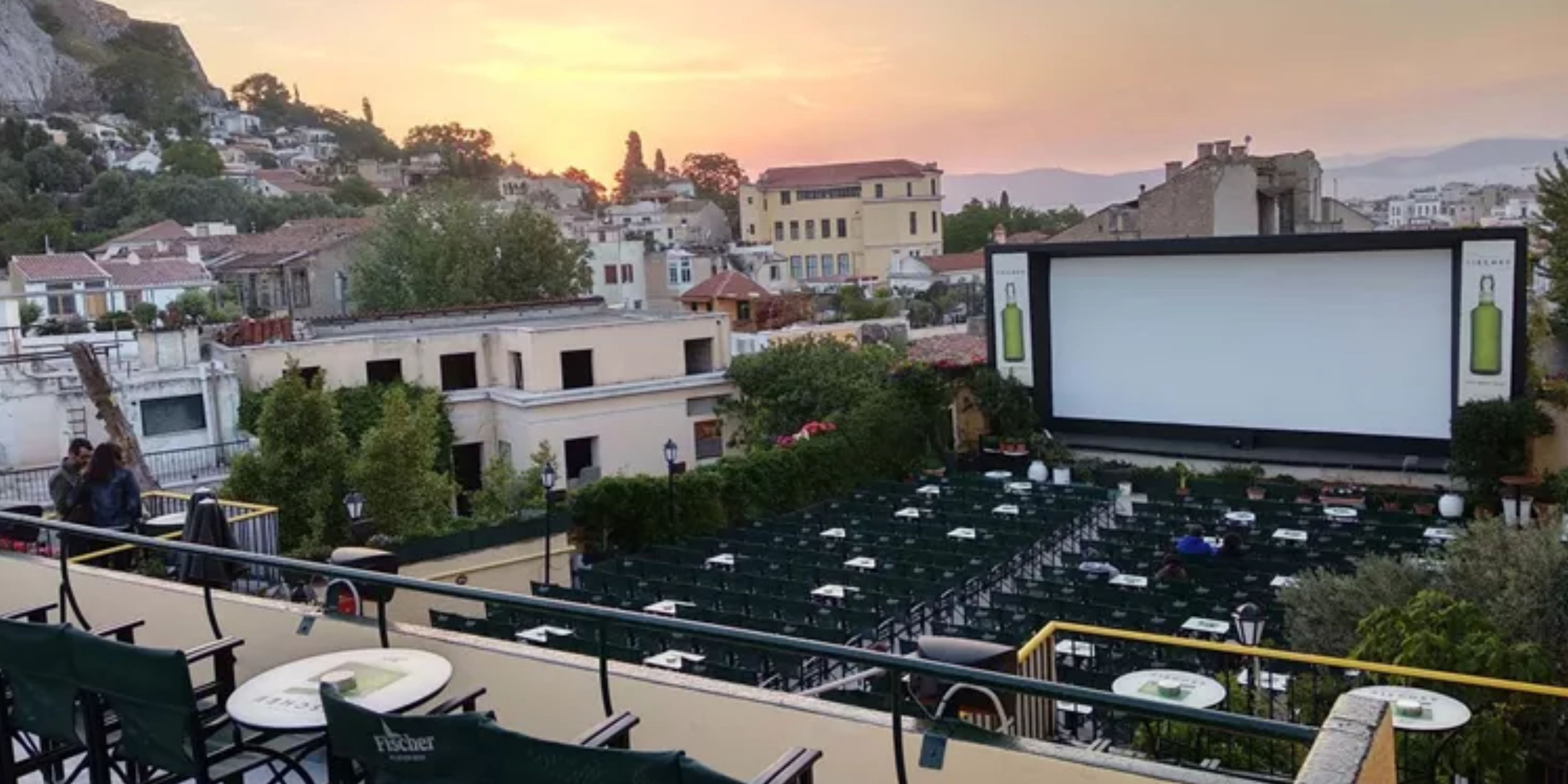 Outdoor movie theater Cine Paris in Athens with seating and a large screen at dusk.